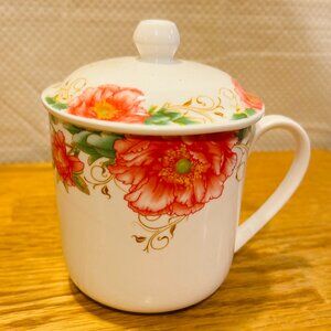 Beautiful floral tea cup with lid, never used. Opening is 4".  Never used.